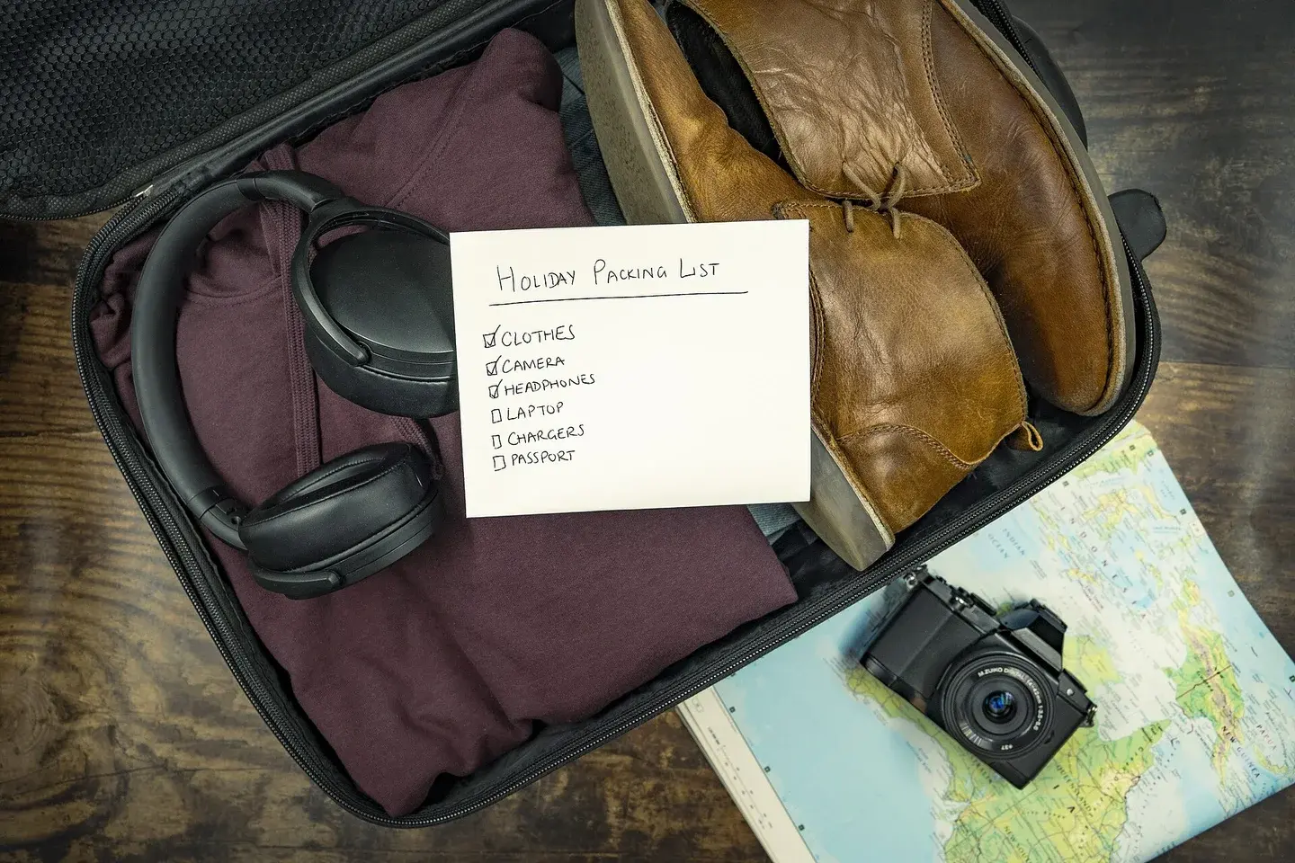 Clothing and travel accessories packed in a suitcase